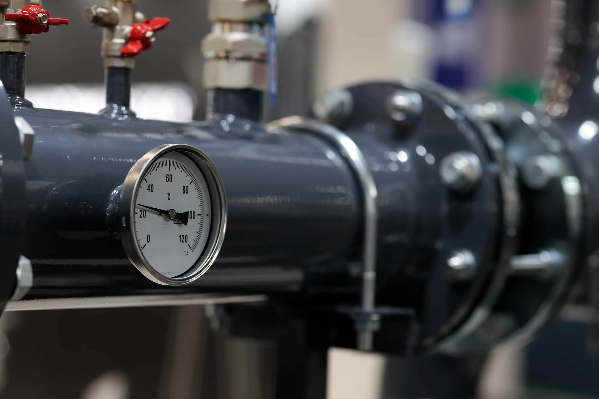 water heating system pipe with temperature gauge